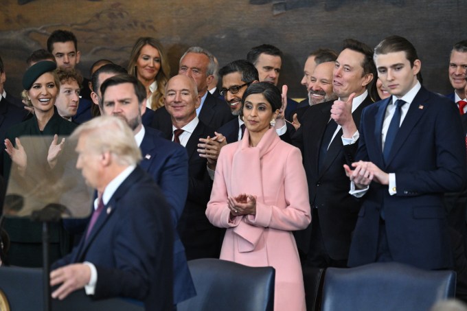 President Donald Trump is inaugurated, standing before billionaires Mark Zuckerberg (curly hair), Jeff Bezos (bald), and Elon Musk (thumbs up), at the U.S. Capitol Rotunda on January 20, 2025 in Washington, D.C. (Photo by Saul Loeb/Pool/Getty Images)